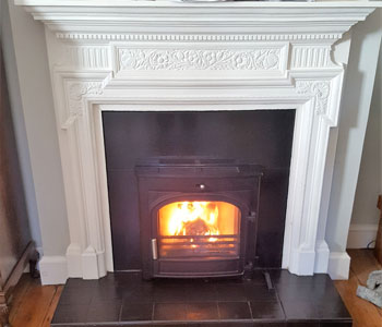 Hunter Telford Inset 8 Multi-fuel Stove - installed with slate slips and header into period fireplace in Walton-on-Thames, Surrey.